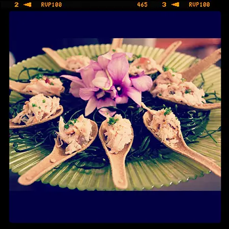 A plate of food with wooden spoons on it